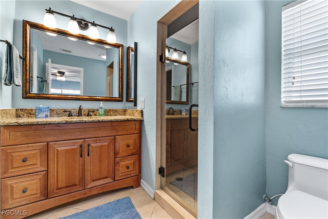 3717 Hanover Street Fort Myers, FL 33901 - Photo 20 of 41 a bathroom with a sink and a mirror with toilet