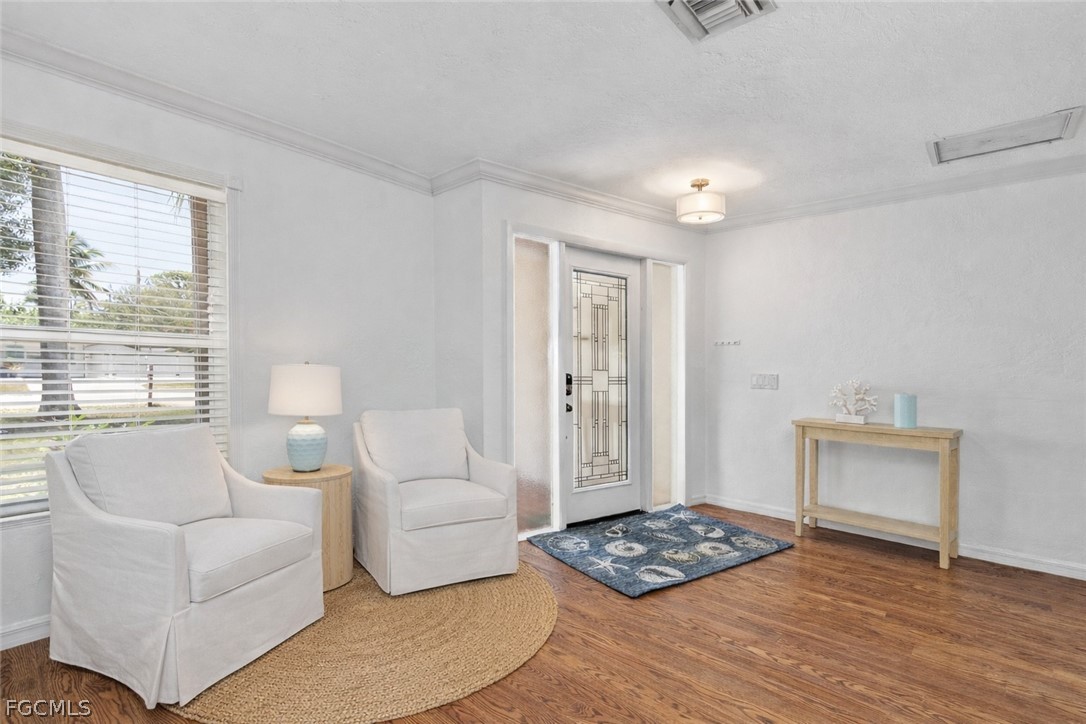 3717 Hanover Street Fort Myers, FL 33901 - Photo 2 of 41 a living room with furniture and a window