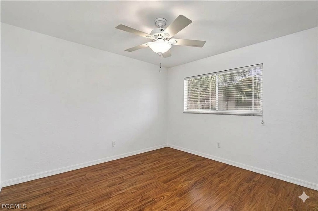3717 Hanover Street Fort Myers, FL 33901 - Photo 22 of 41 a view of a room with wooden floor and fan