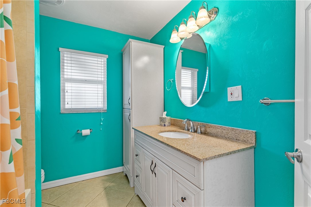 3717 Hanover Street Fort Myers, FL 33901 - Photo 23 of 41 a bathroom with a sink and a mirror