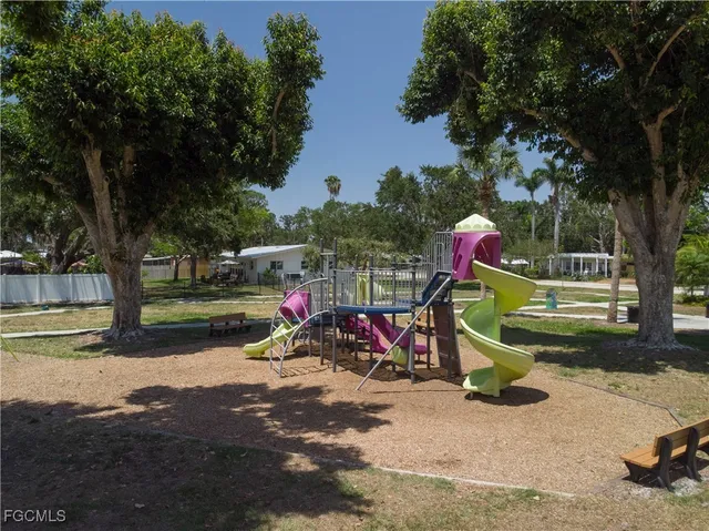 a view of a park with swings and slides