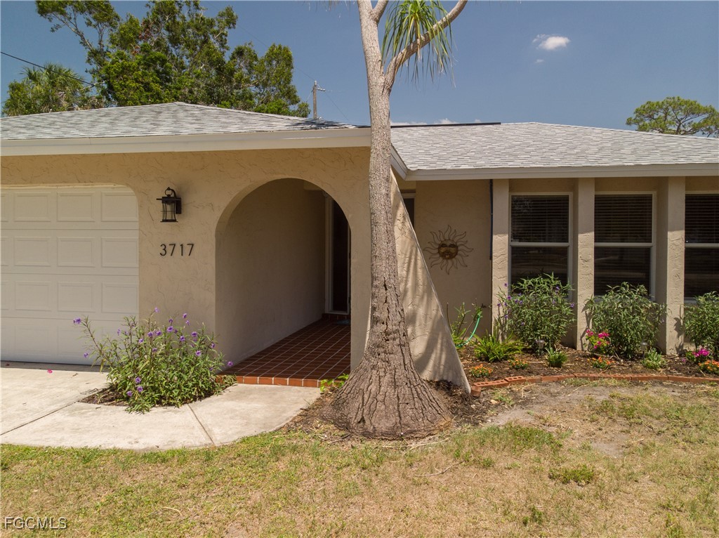 3717 Hanover Street Fort Myers, FL 33901 - Photo 29 of 41 a front view of a house with a yard