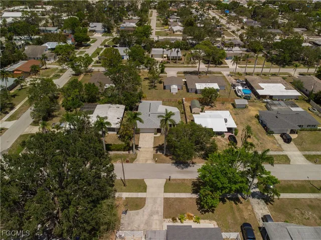 an aerial view of residential houses with outdoor space
