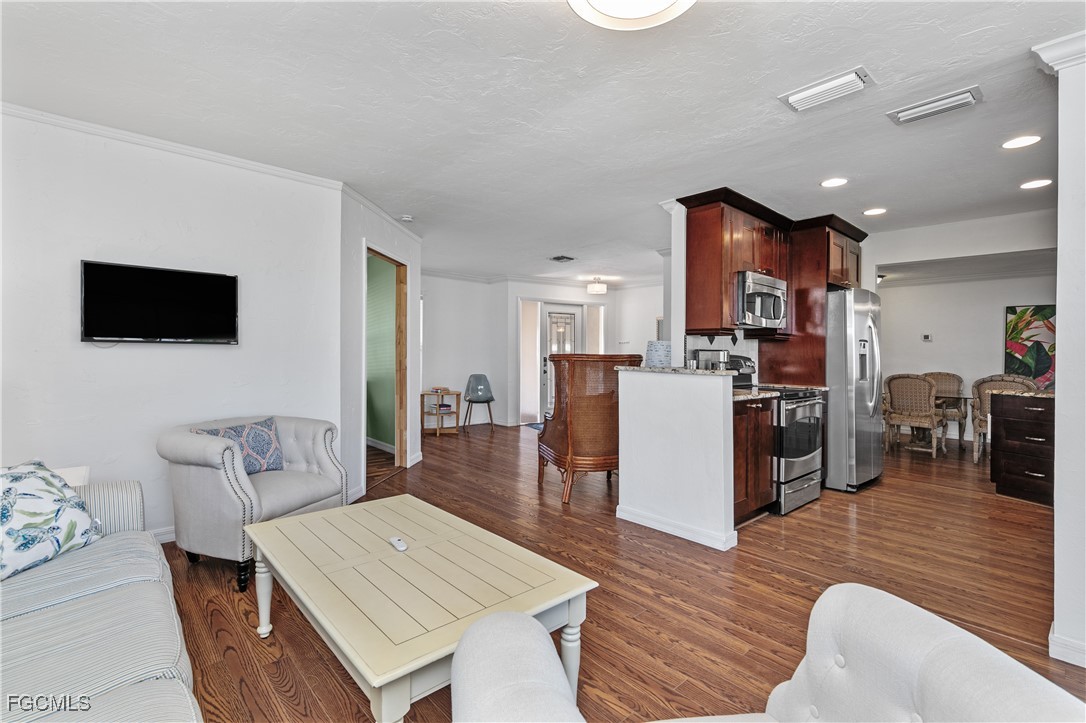 3717 Hanover Street Fort Myers, FL 33901 - Photo 8 of 41 a living room with furniture and a flat screen tv