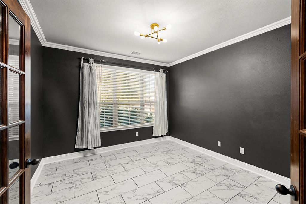 1102 Brigham Drive Forney, TX 75126 - Photo 6 of 25 a view of an empty room with a window