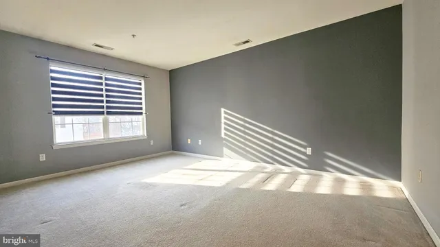 a view of empty room with windows