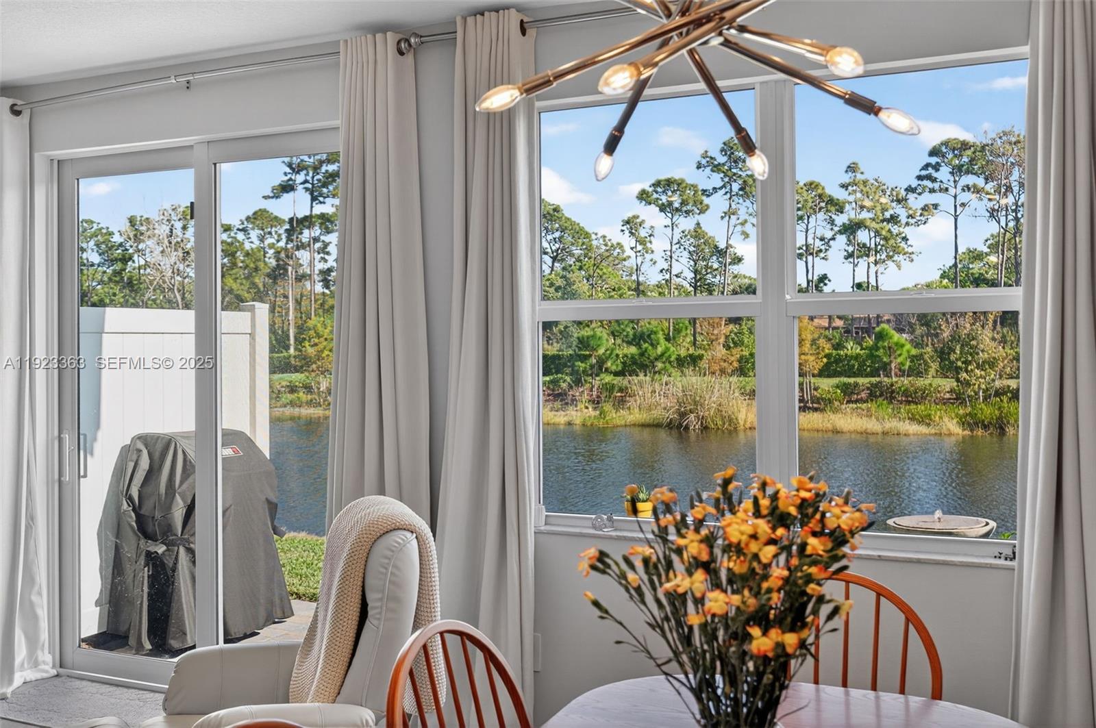 5746 Southeast Edgewater Circle Stuart, FL 34997 - Photo 14 of 38 a view of a dining room with furniture window and outside view