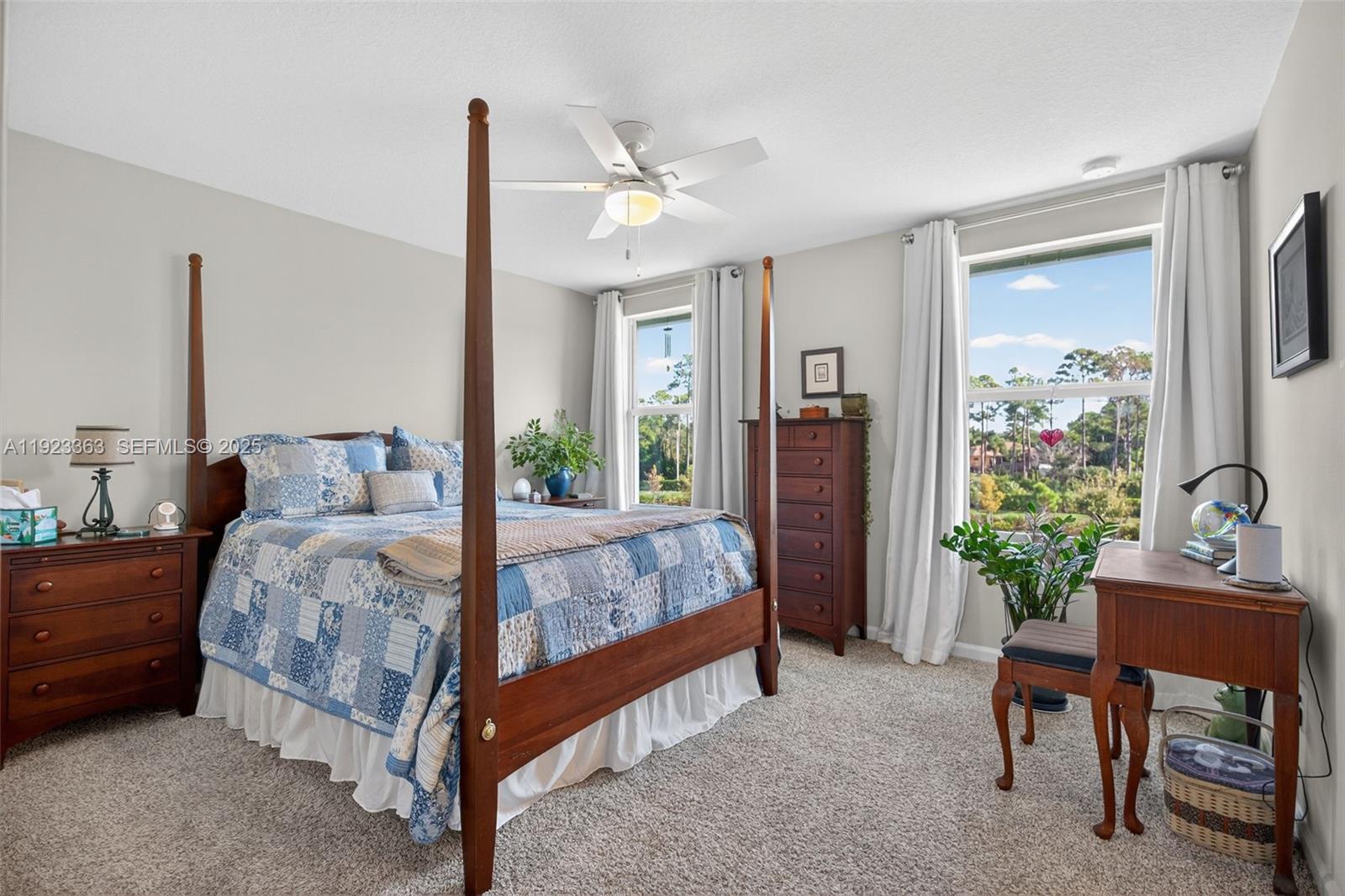 5746 Southeast Edgewater Circle Stuart, FL 34997 - Photo 21 of 38 a bed room with a bed and a table