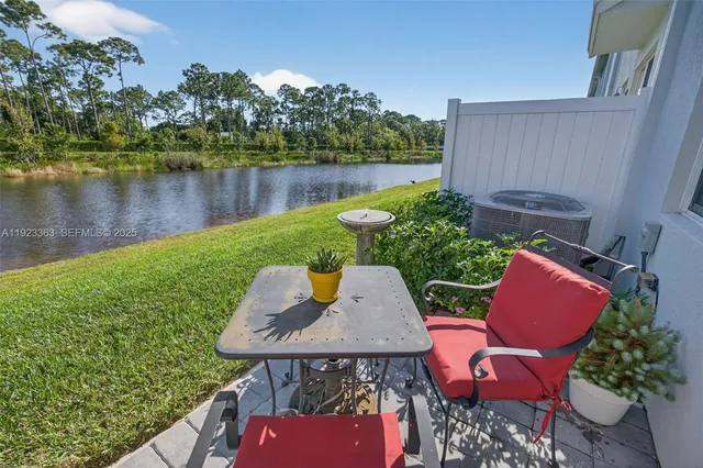 a view of a lake with a house in the background