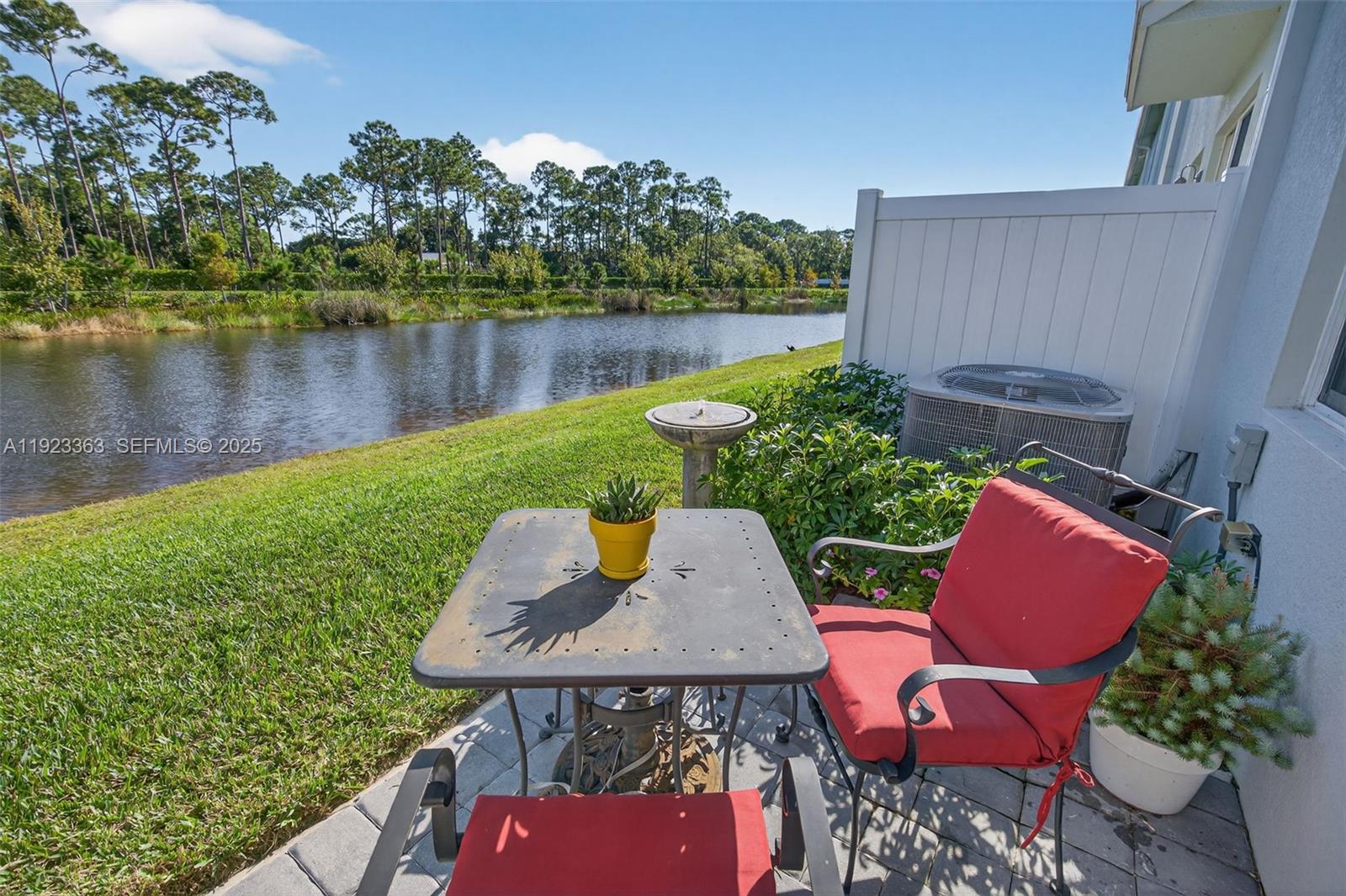 5746 Southeast Edgewater Circle Stuart, FL 34997 - Photo 31 of 38 an outdoor sitting area with furniture