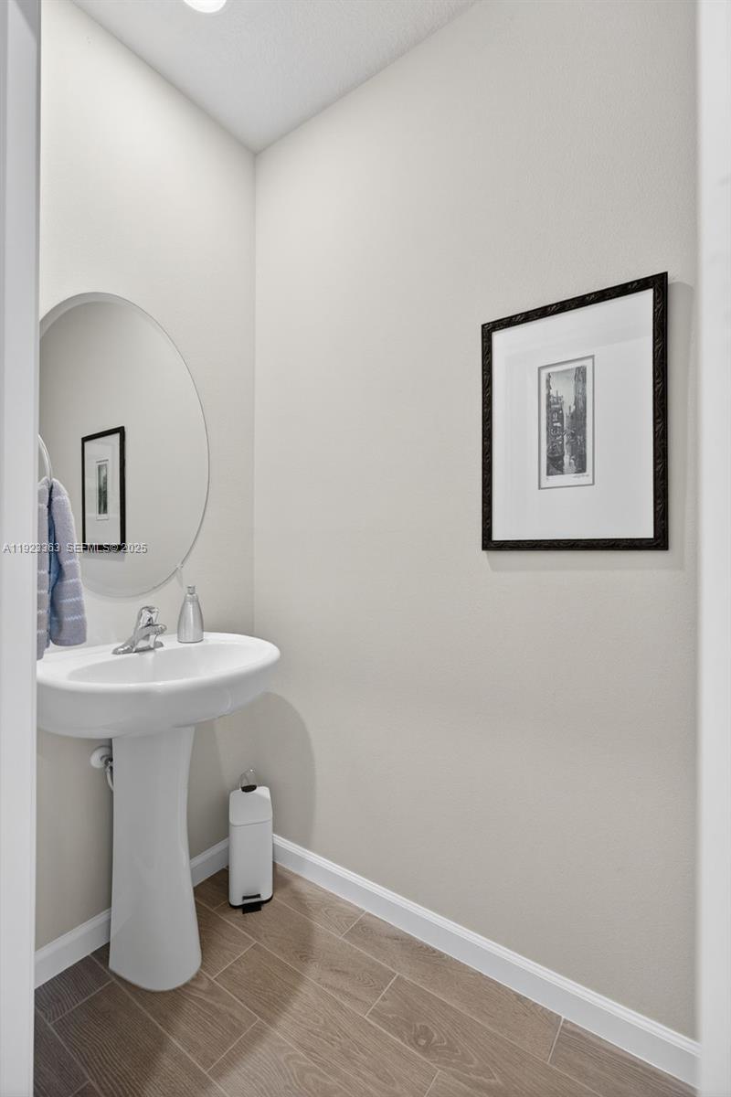 5746 Southeast Edgewater Circle Stuart, FL 34997 - Photo 4 of 38 a bathroom with a sink and a mirror