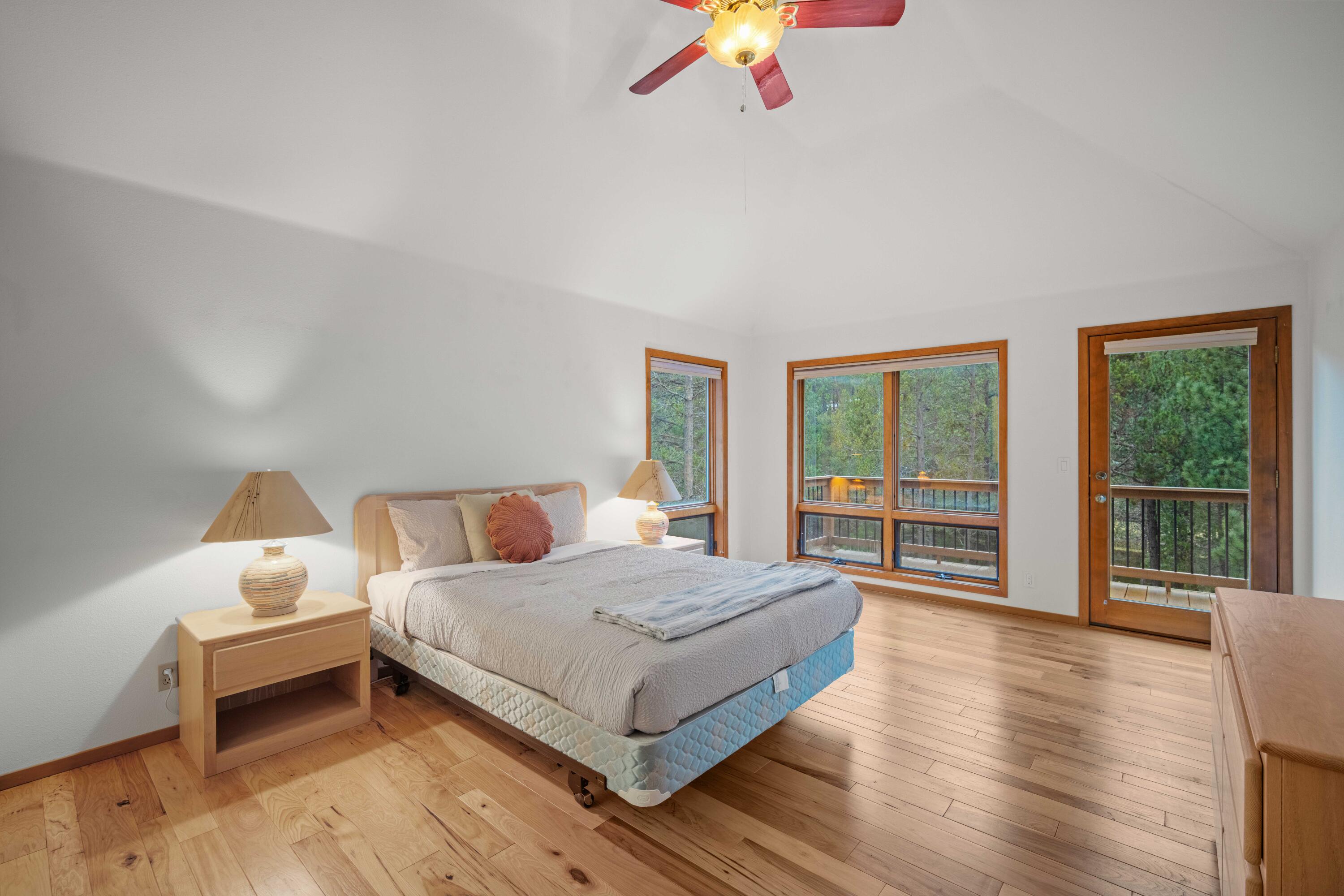 17674 Bittern Lane, Unit 7 Sunriver, OR 97707 - Photo 16 of 43 Primary suite with private deck access that overlooks the forest and river views.