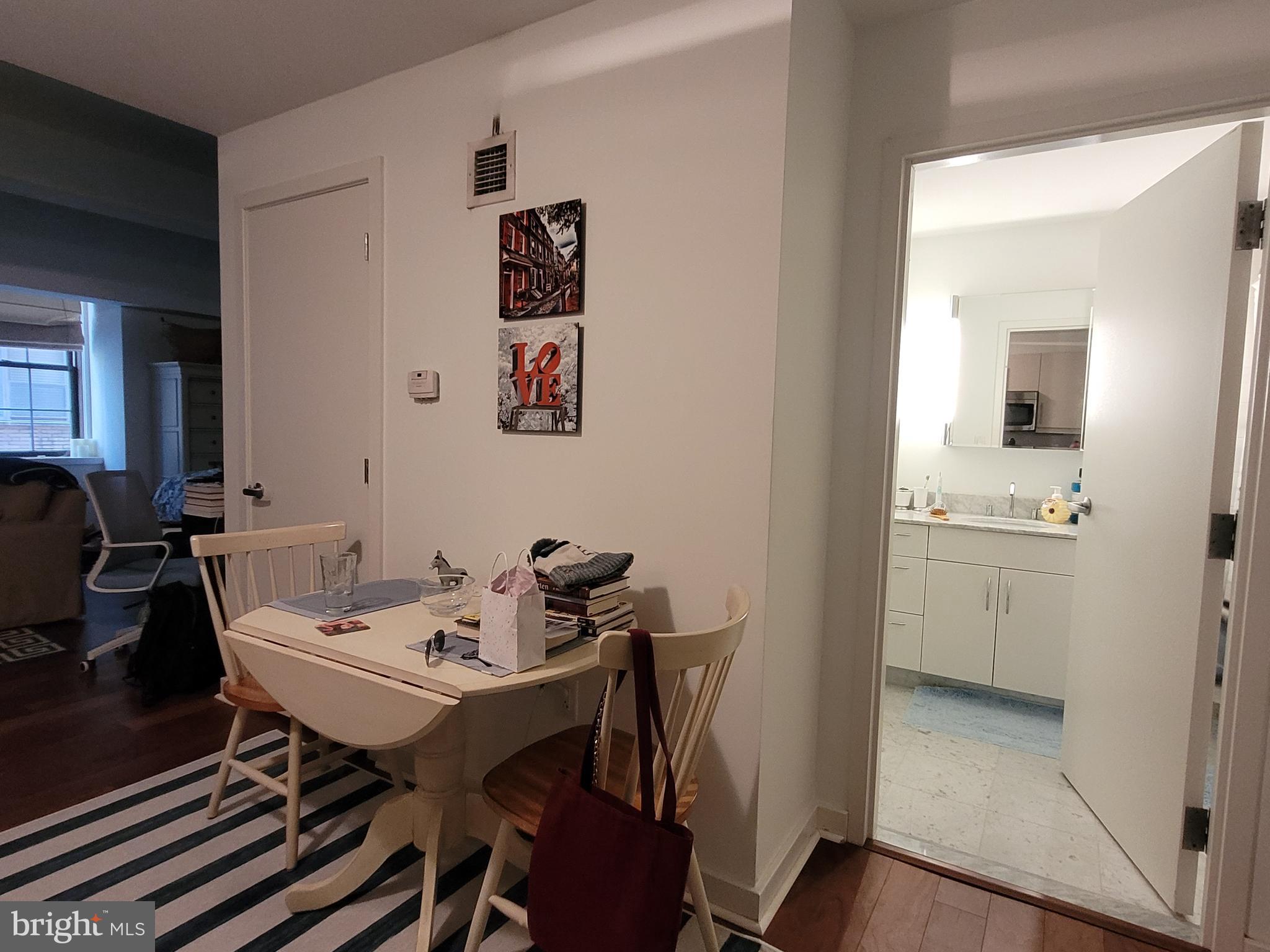 219-29 South 18th Street, Unit 405A Philadelphia, PA 19103 - Photo 8 of 19 a view of a dining room with furniture and bathroom