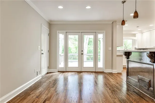 a view of a livingroom with wooden floor