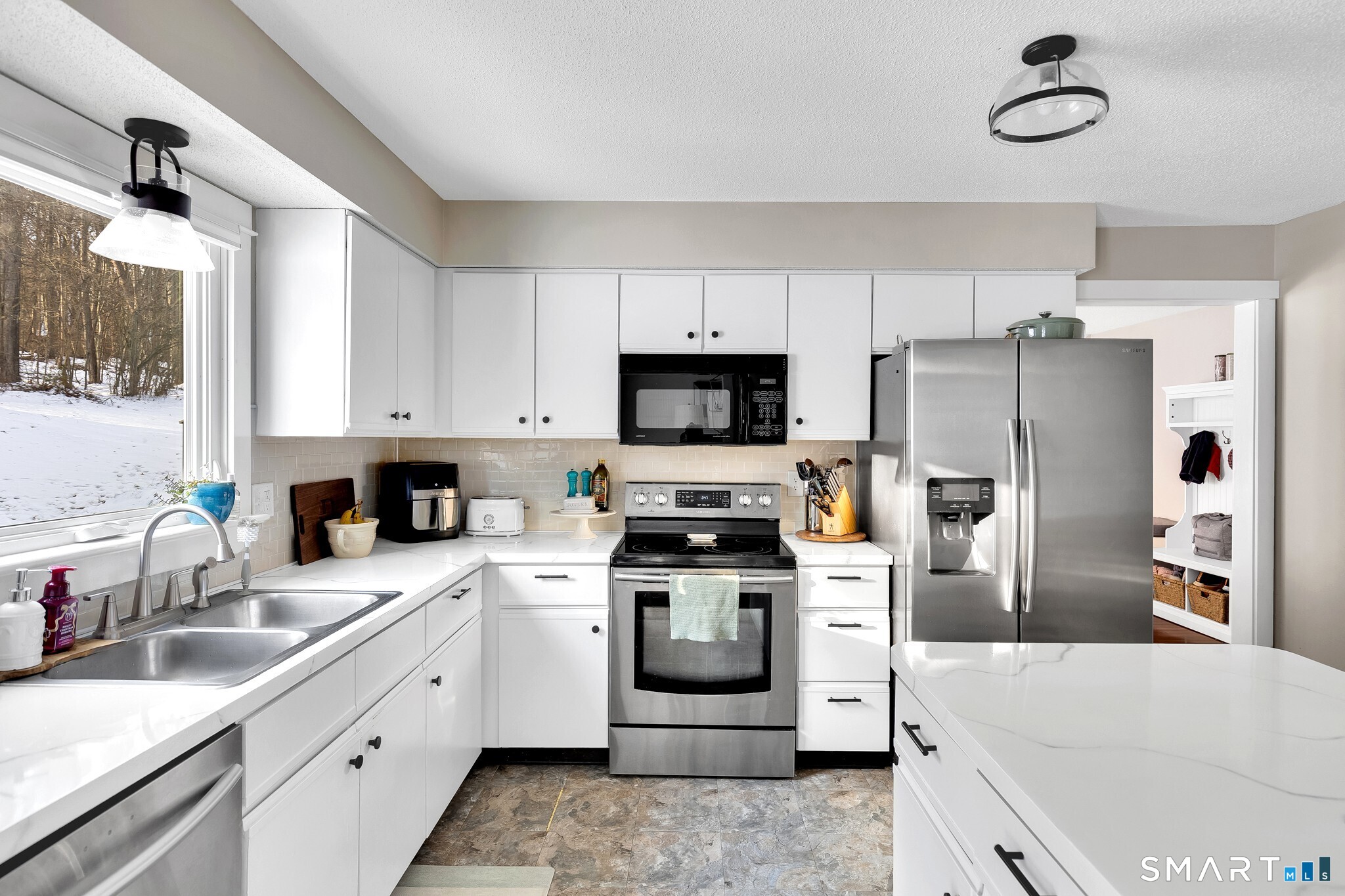 22 Harnish Lane Wallingford, CT 06492 - Photo 7 of 27 Kitchen from Dining Room Table