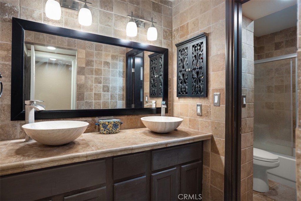32 Columbia Irvine, CA 92612 - Photo 21 of 34 a bathroom with a granite countertop sink toilet and shower