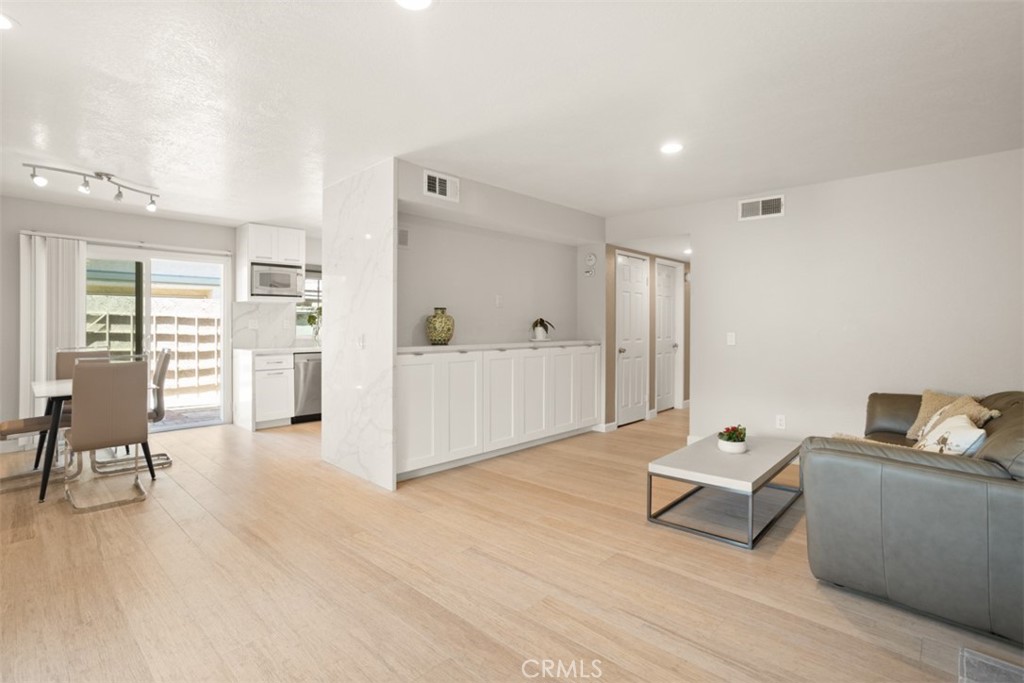 32 Columbia Irvine, CA 92612 - Photo 3 of 34 a living room with furniture and a wooden floor
