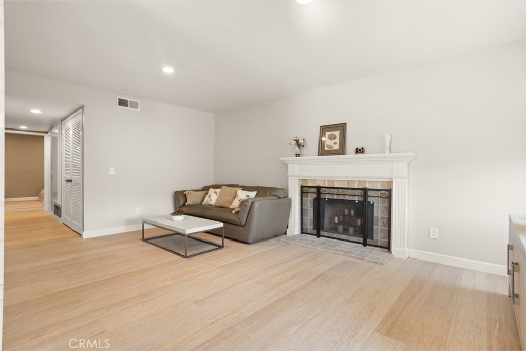 32 Columbia Irvine, CA 92612 - Photo 4 of 34 a living room with furniture and a fireplace