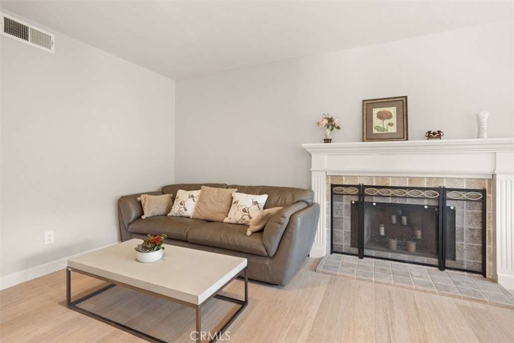 32 Columbia Irvine, CA 92612 - Photo 5 of 34 a living room with furniture and a fireplace