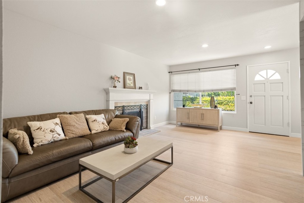 32 Columbia Irvine, CA 92612 - Photo 6 of 34 a living room with furniture and a fireplace