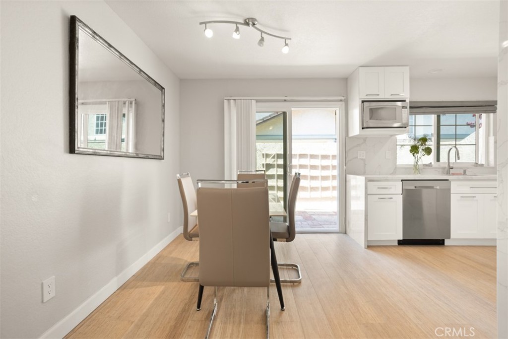32 Columbia Irvine, CA 92612 - Photo 8 of 34 a view of a dining room with furniture window and wooden floor