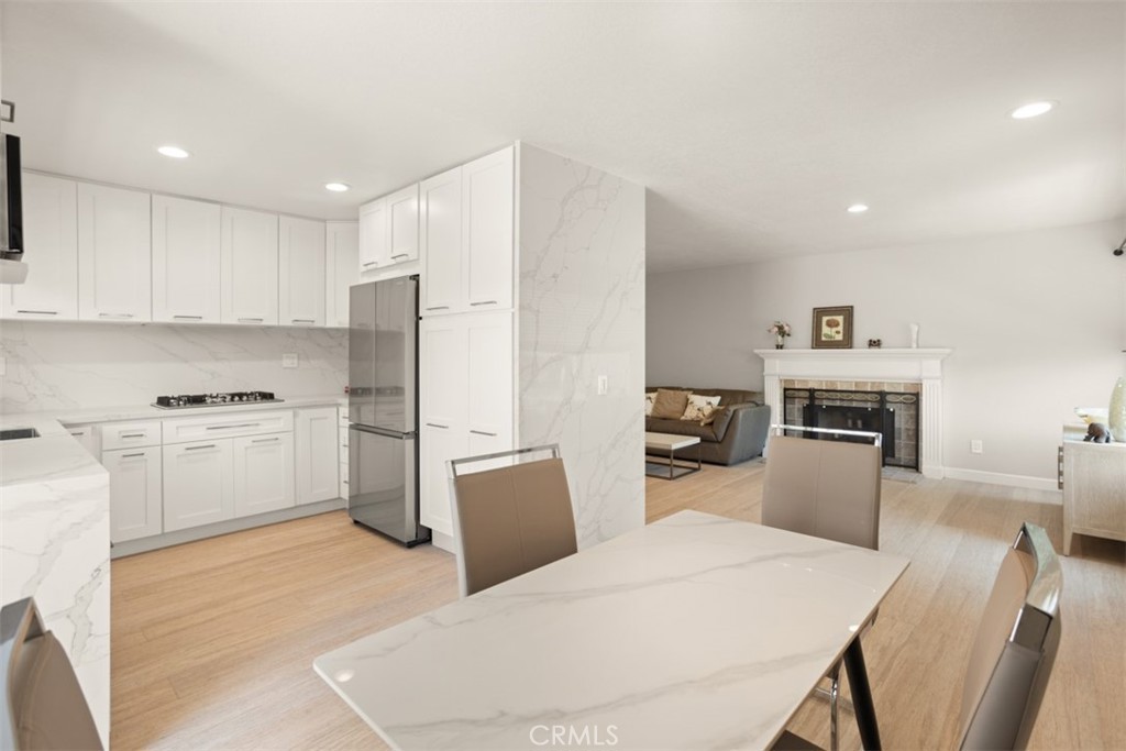 32 Columbia Irvine, CA 92612 - Photo 9 of 34 a kitchen with white cabinets and stainless steel appliances