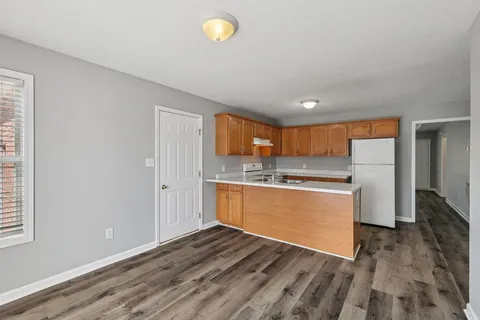 a view of kitchen with wooden floor