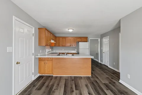 a view of kitchen with wooden floor