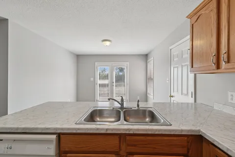 a kitchen with sink and window