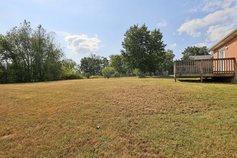 a view of a big room with table and chairs