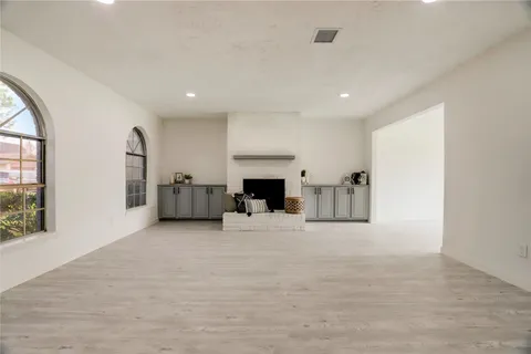 a view of a livingroom with furniture and a fireplace