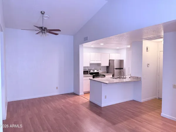 a view of kitchen with sink microwave and stove