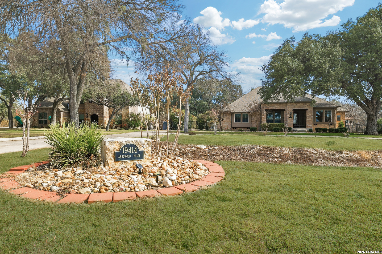 a front view of a house with a big yard