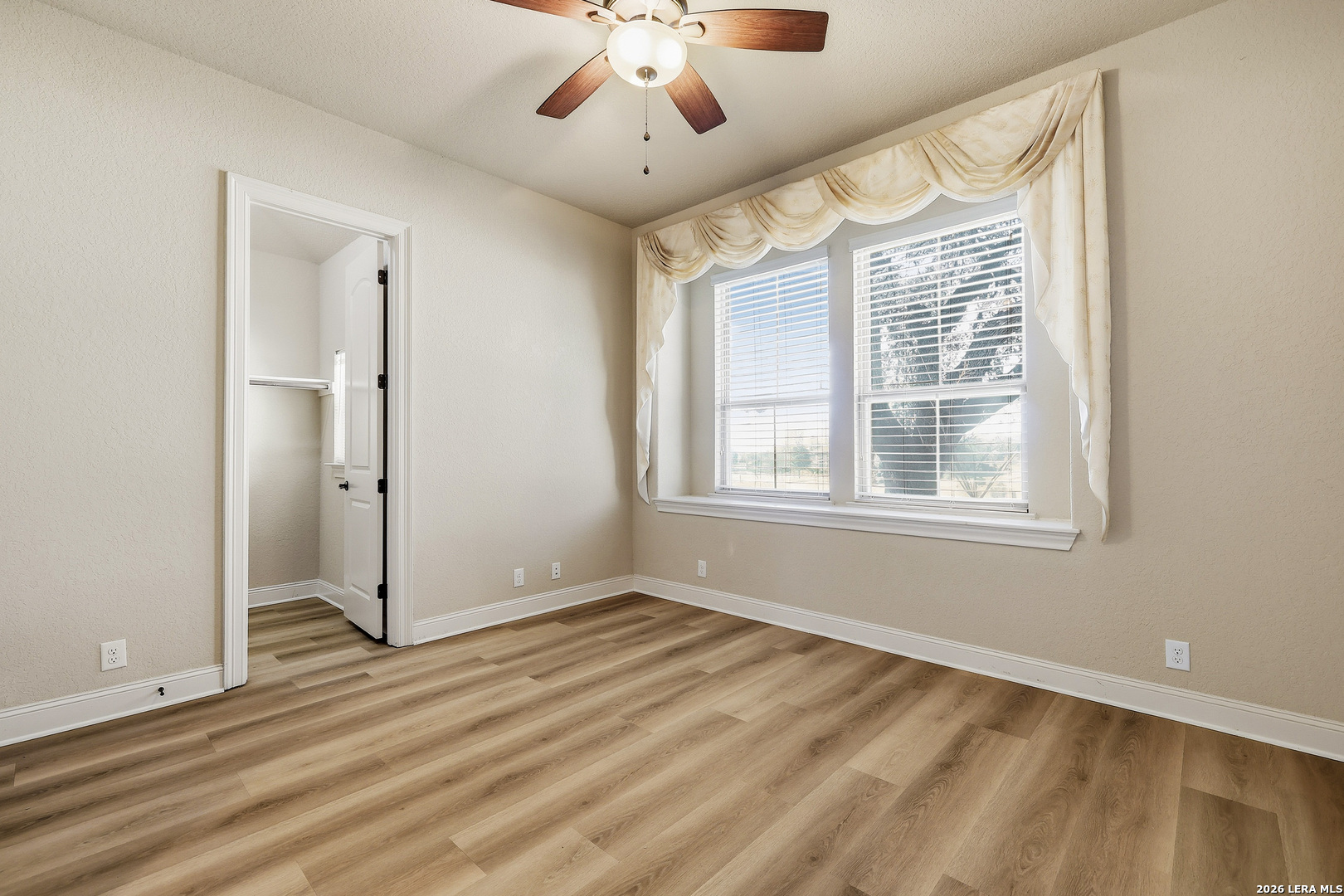 19414 Arrowood Place Garden Ridge, TX 78266 - Photo 19 of 25 a view of an empty room with a window