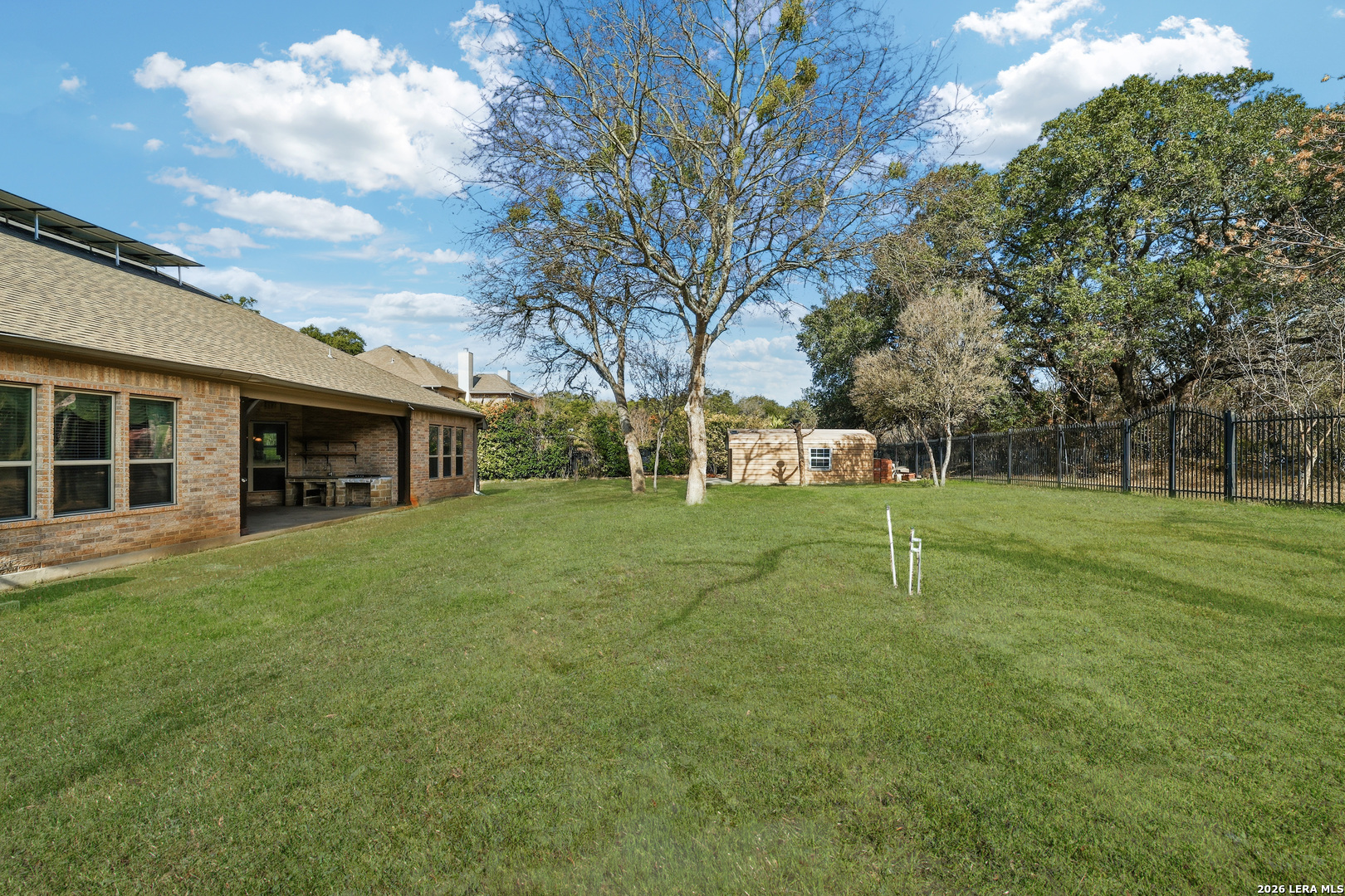 19414 Arrowood Place Garden Ridge, TX 78266 - Photo 23 of 25 a view of a house with a backyard