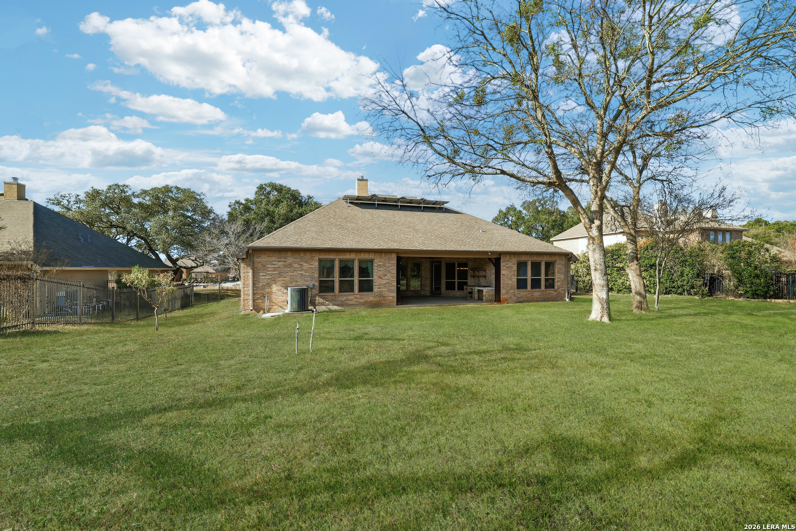 19414 Arrowood Place Garden Ridge, TX 78266 - Photo 25 of 25 a front view of a house with a garden