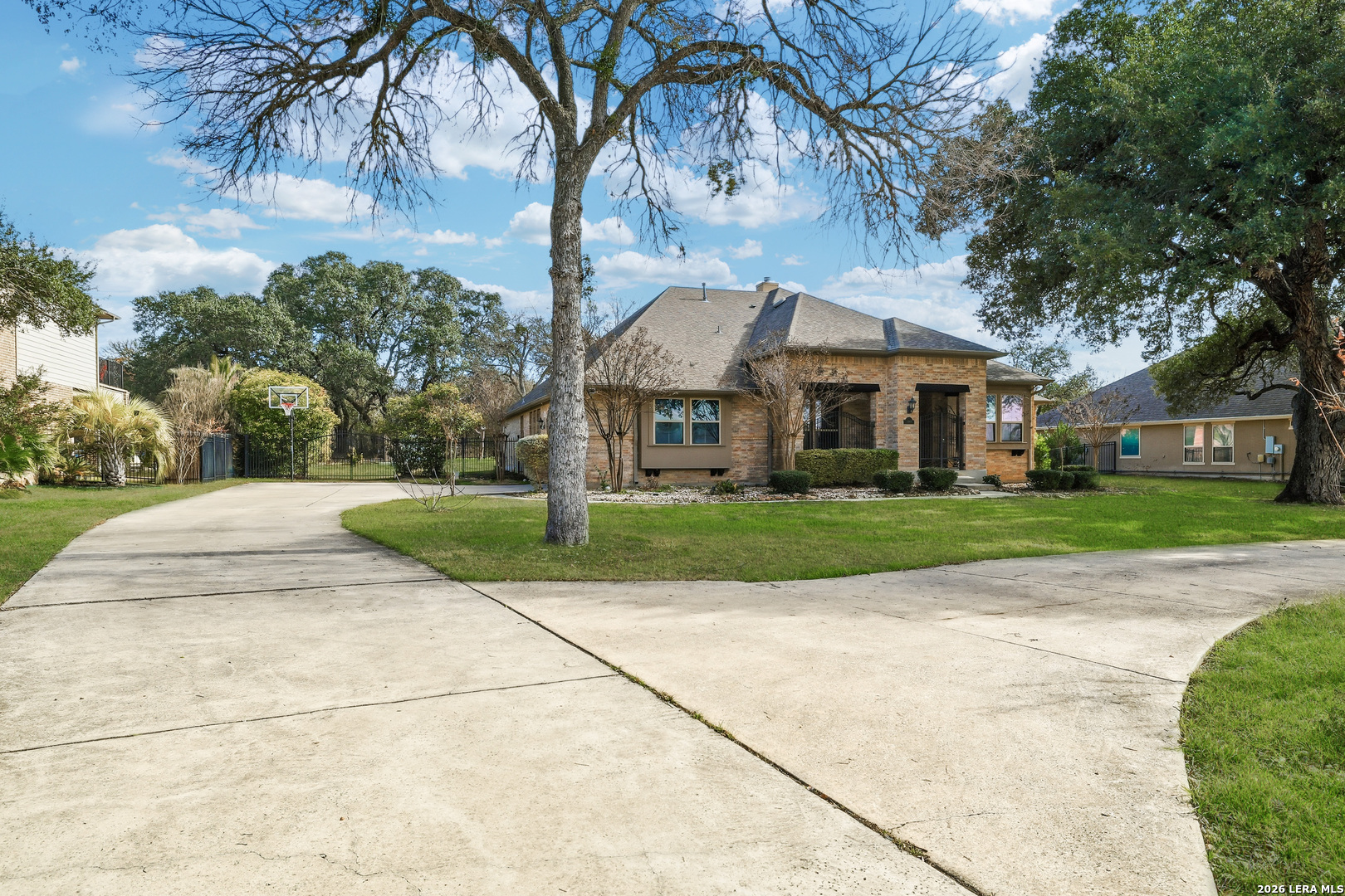 19414 Arrowood Place Garden Ridge, TX 78266 - Photo 3 of 25 a front view of house with yard and green space