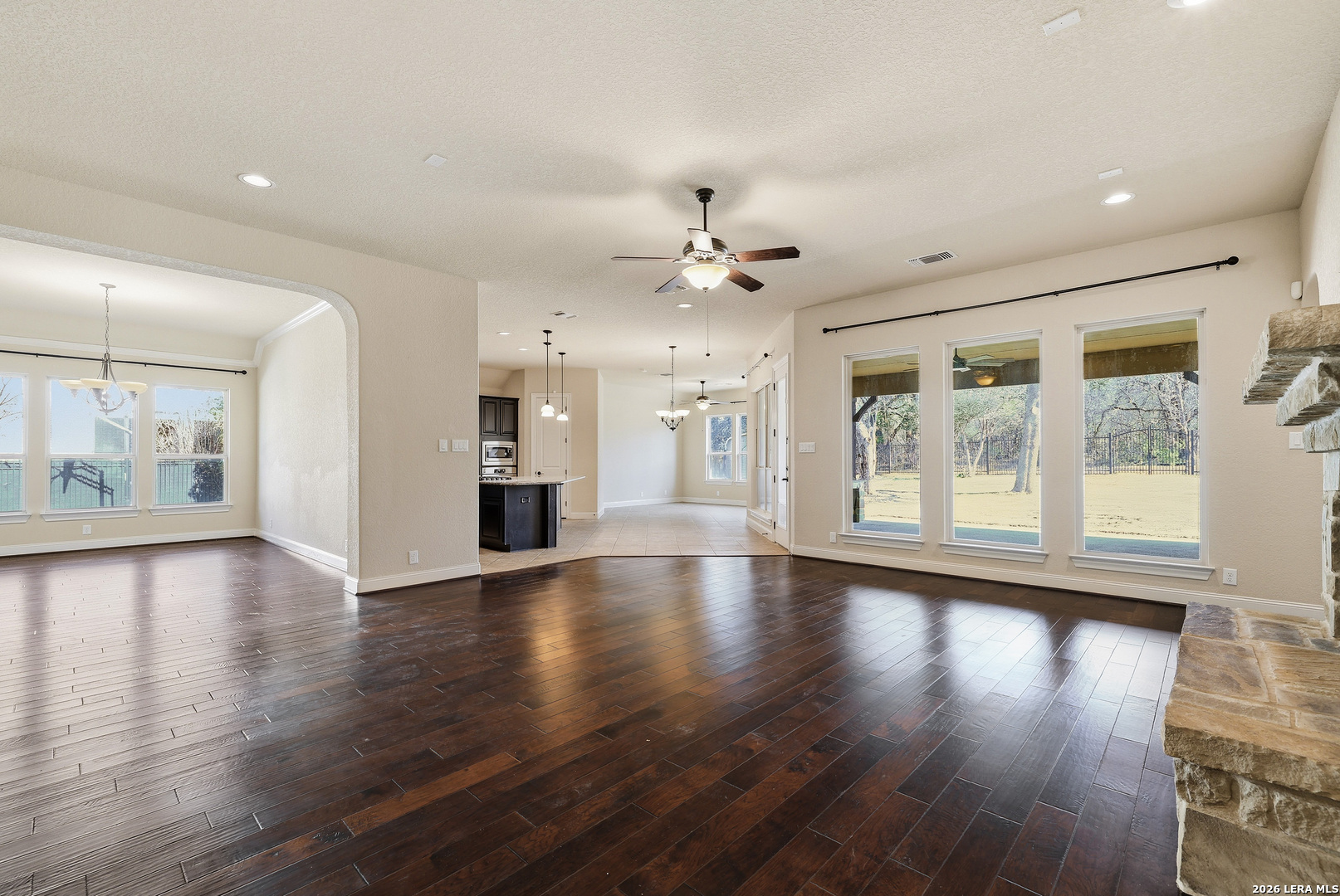 19414 Arrowood Place Garden Ridge, TX 78266 - Photo 5 of 25 a view of an empty room with wooden floor and a window