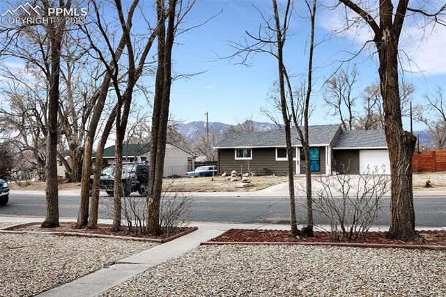 513 Huron Road Colorado Springs, CO 80910 - Photo 25 of 26 Street/mountain view from the front porch!