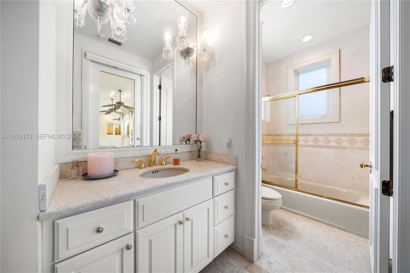 8400 School House Road Miami, FL 33143 - Photo 21 of 66 a bathroom with a double vanity sink mirror and shower