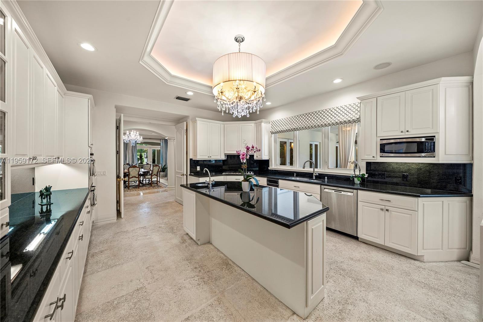 8400 School House Road Miami, FL 33143 - Photo 26 of 66 a large kitchen with stainless steel appliances granite countertop a stove and a sink