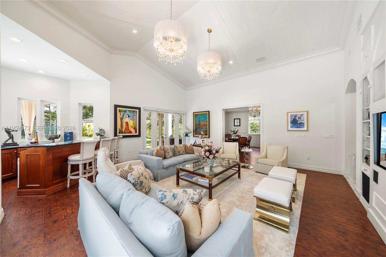 8400 School House Road Miami, FL 33143 - Photo 31 of 66 a living room with furniture chandelier and a table