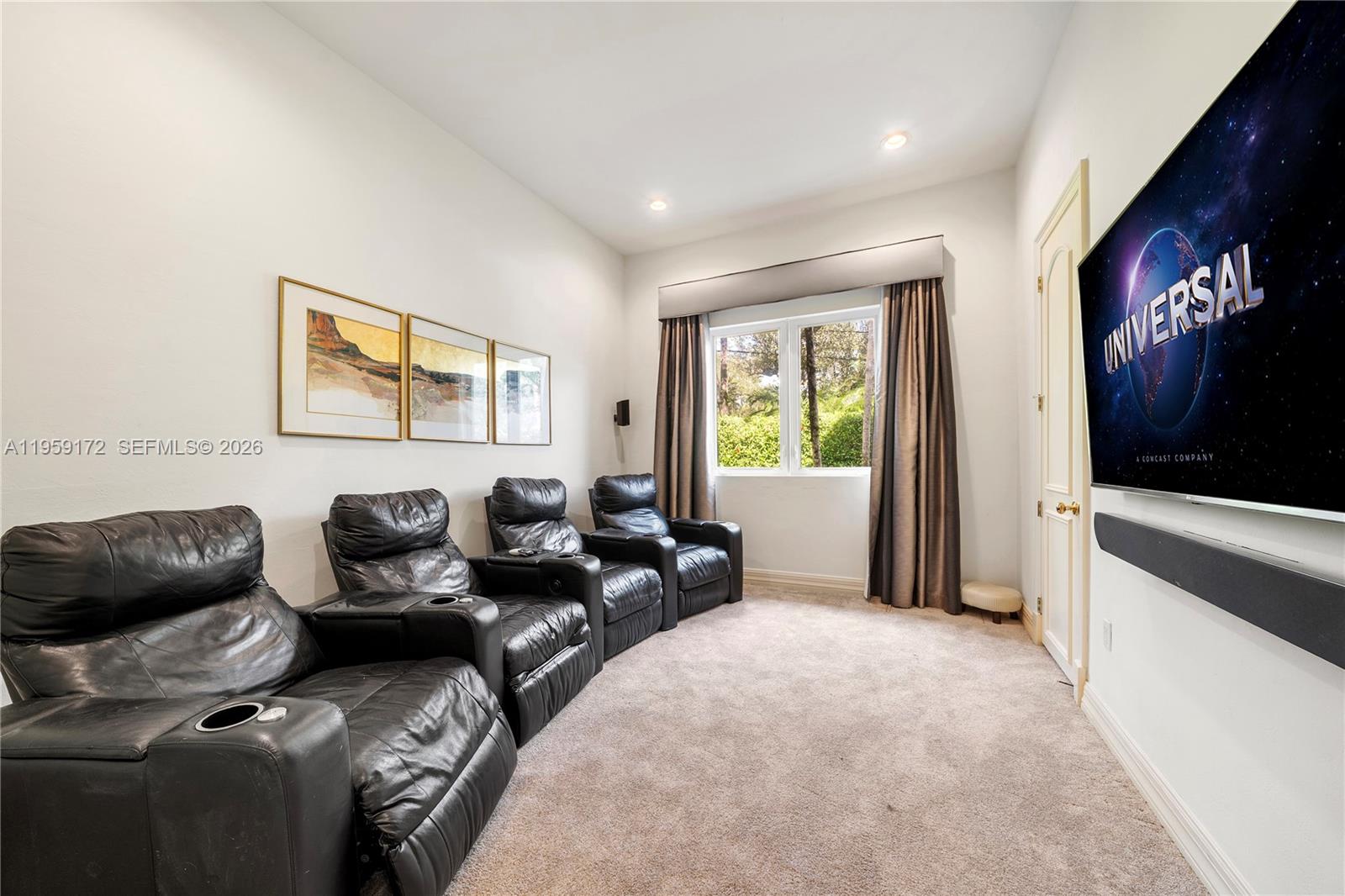8400 School House Road Miami, FL 33143 - Photo 35 of 66 a living room with furniture and a flat screen tv