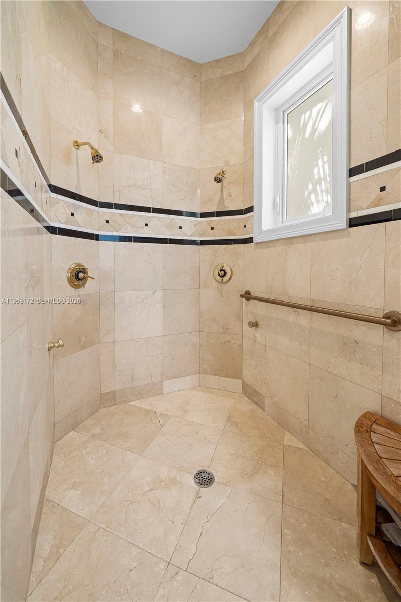 8400 School House Road Miami, FL 33143 - Photo 45 of 66 a bathroom with a bathtub and a shower