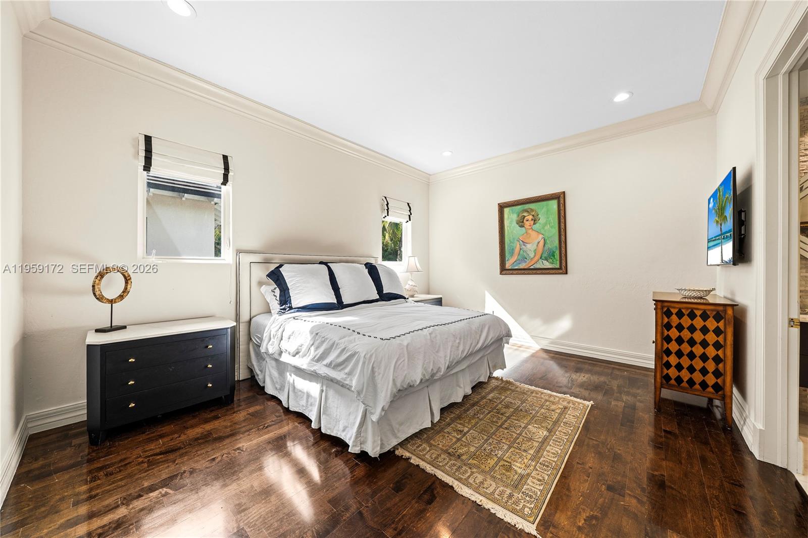 8400 School House Road Miami, FL 33143 - Photo 50 of 66 a bedroom with a bed and wooden floor