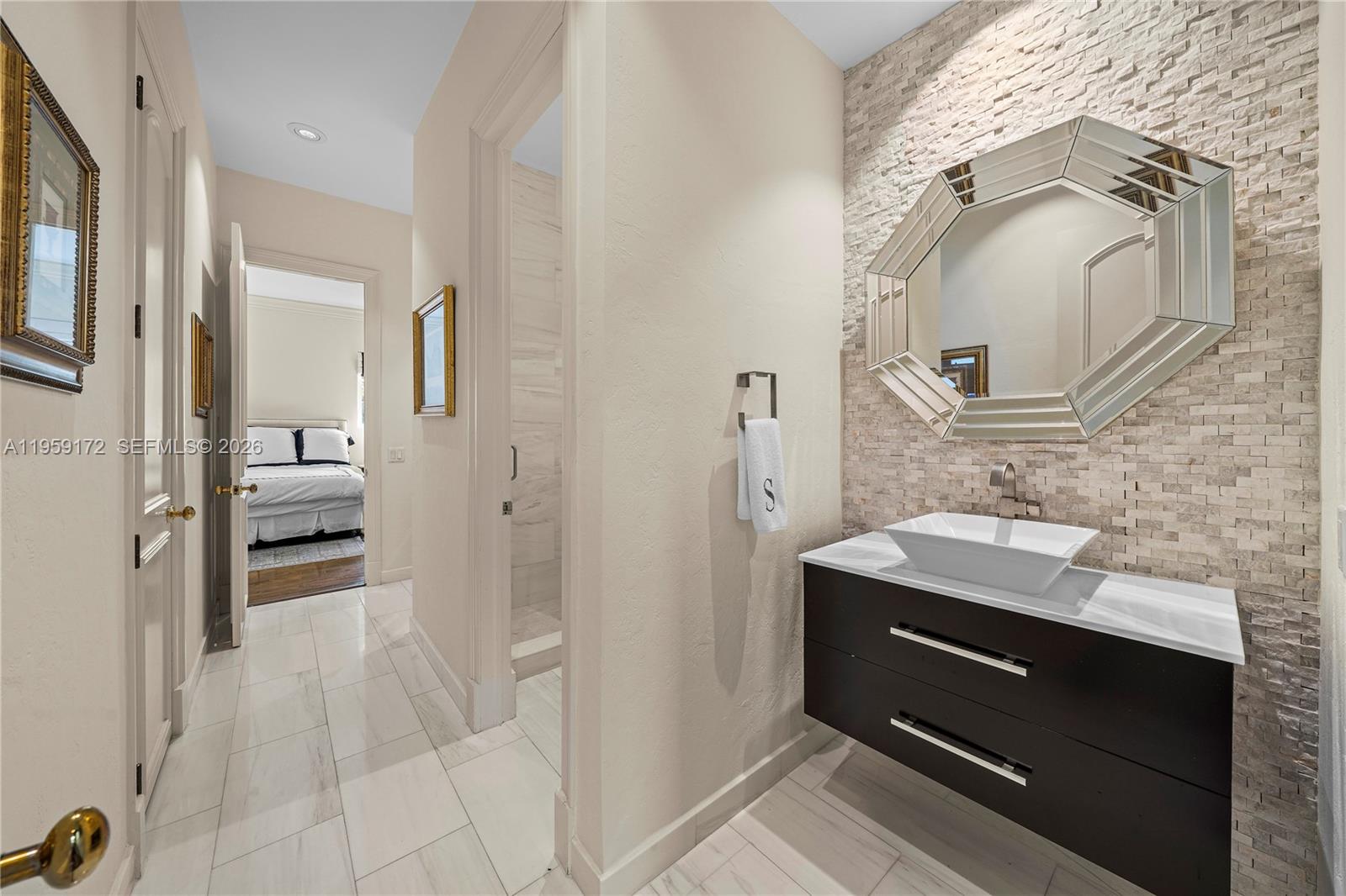 8400 School House Road Miami, FL 33143 - Photo 51 of 66 a bathroom with a sink and a mirror