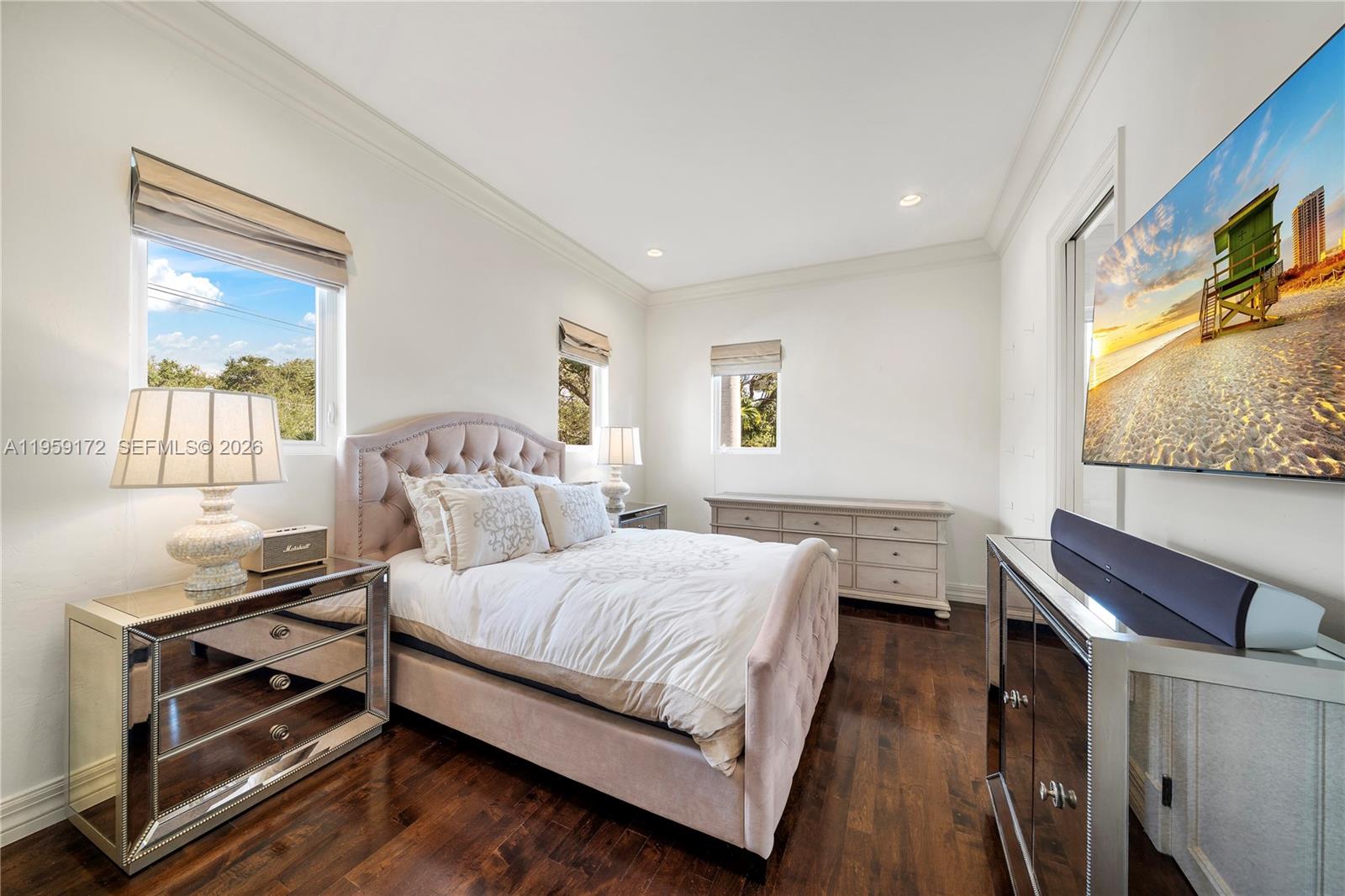 8400 School House Road Miami, FL 33143 - Photo 52 of 66 a bedroom with a bed and wooden floor