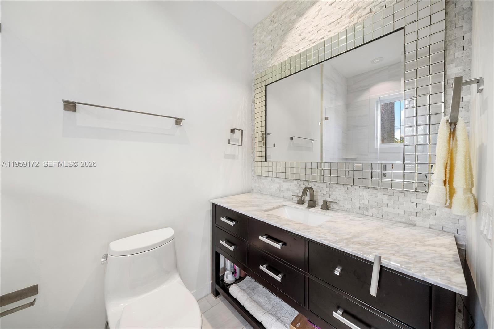 8400 School House Road Miami, FL 33143 - Photo 53 of 66 a bathroom with a sink and a toilet