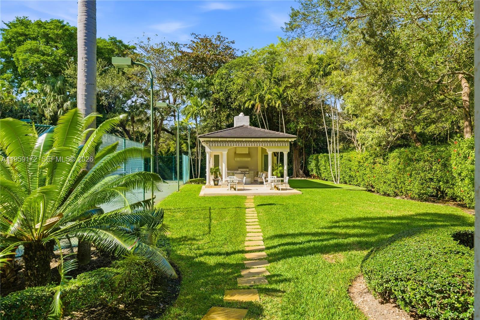 8400 School House Road Miami, FL 33143 - Photo 56 of 66 a front view of house with yard and green space