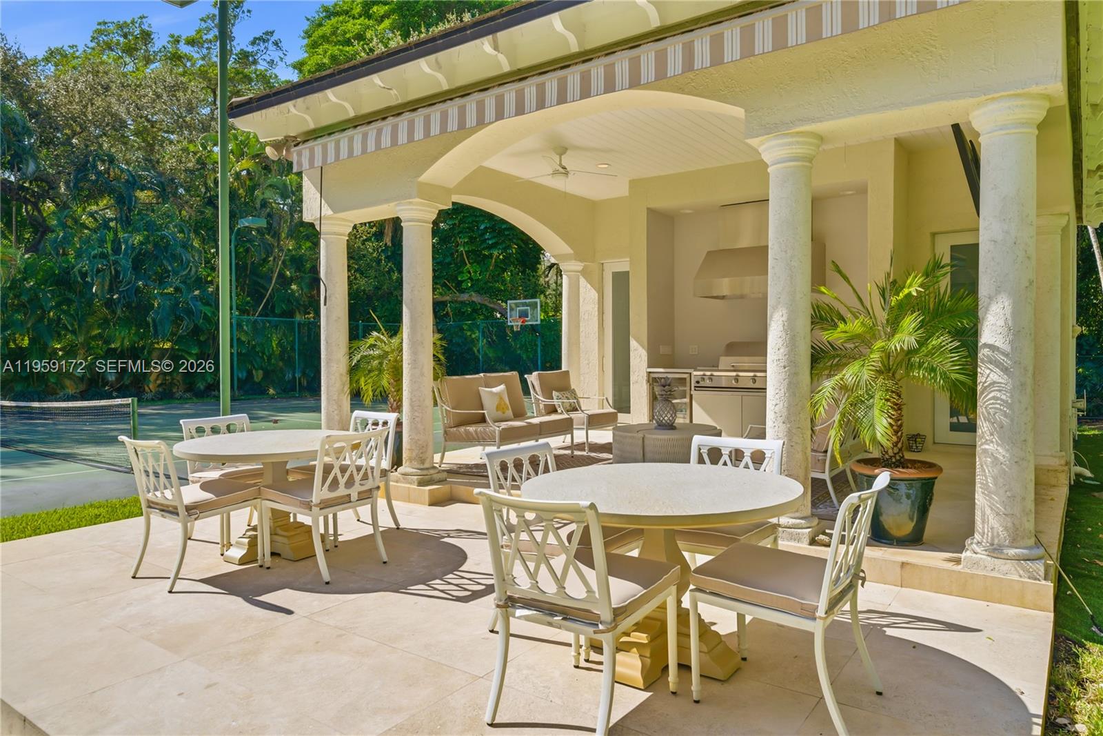 8400 School House Road Miami, FL 33143 - Photo 58 of 66 a view of a patio with table and chairs and potted plants